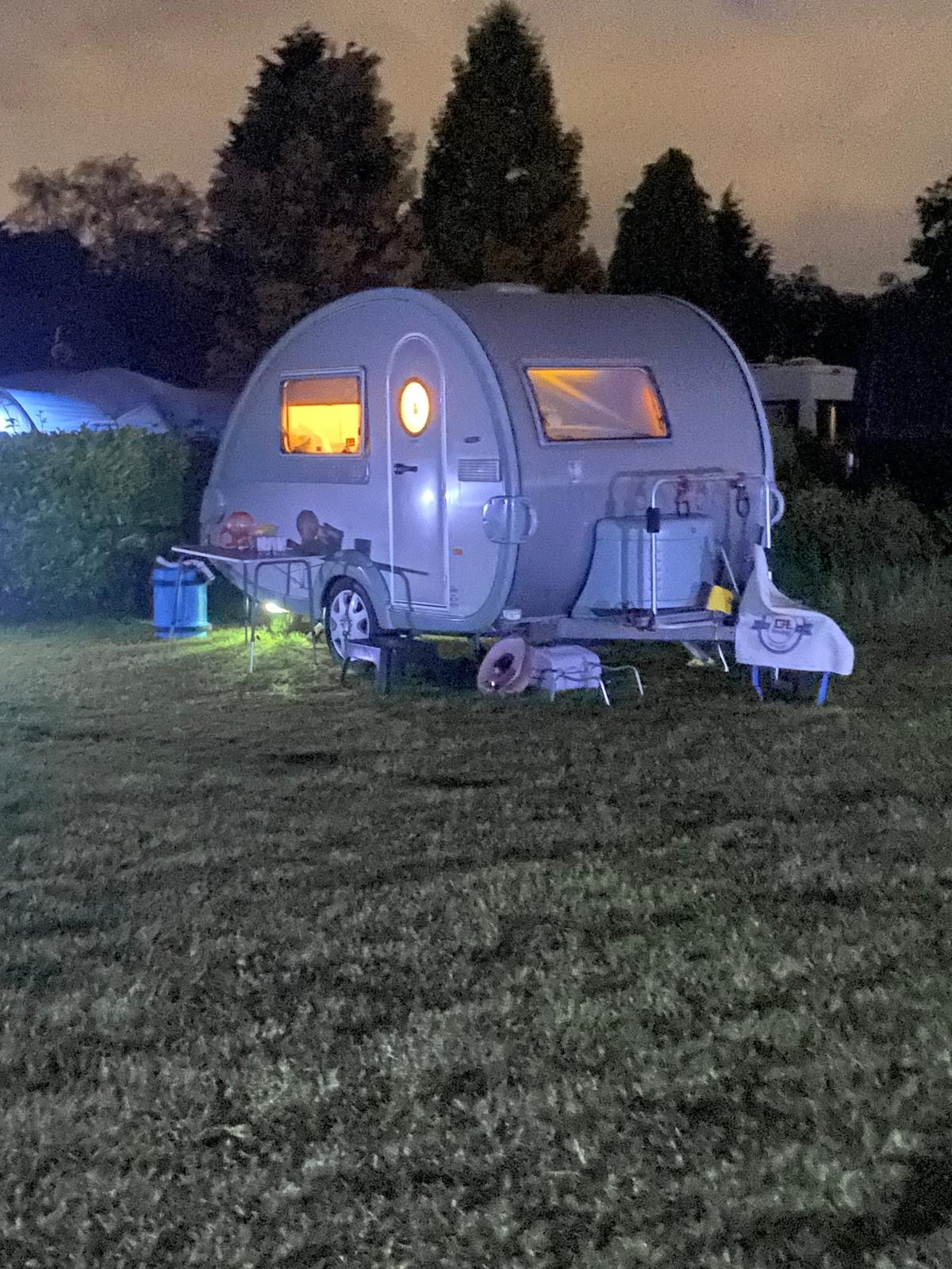 An illuminated teardrop caravan