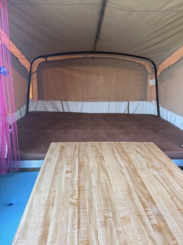 Inside are 2 double sleeping compartments and a retro table with bench seats